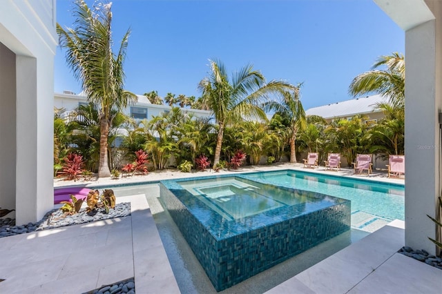 401 39th St, Holmes Beach, FL 34217 - view of swimming pool featuring a patio area and a pool with connected hot tub