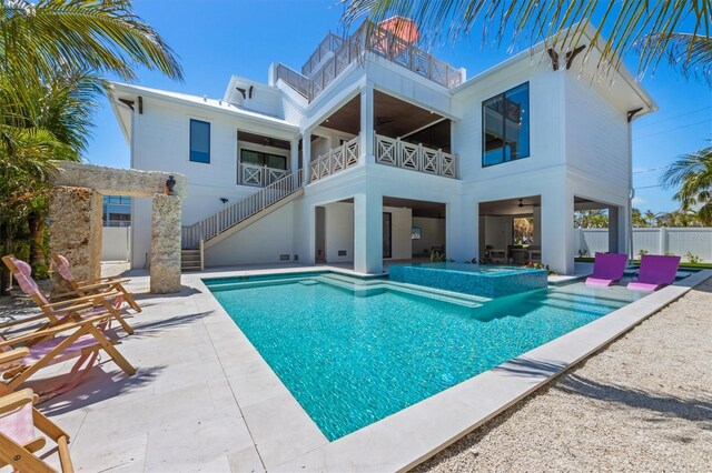 401 39th St, Holmes Beach, FL 34217 - view of swimming pool featuring stairway, a patio, a ceiling fan, and a pool with connected hot tub