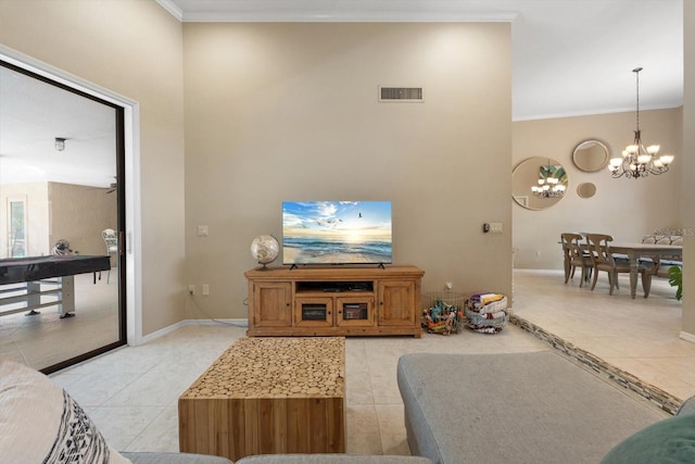 7321 Hemlock Ln, Sarasota, FL 34241 - living room featuring light tile patterned floors, a chandelier, crown molding, and baseboards
