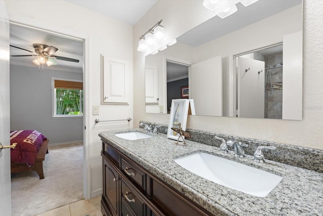 7321 Hemlock Ln, Sarasota, FL 34241 - full bathroom with double vanity, ensuite bathroom, ornamental molding, tile patterned floors, and ceiling fan