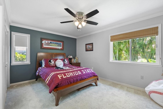 7321 Hemlock Ln, Sarasota, FL 34241 - bedroom with carpet flooring, crown molding, baseboards, and ceiling fan