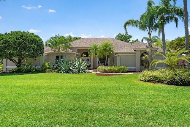 7321 Hemlock Ln, Sarasota, FL 34241 - view of front of home with stucco siding and a front yard