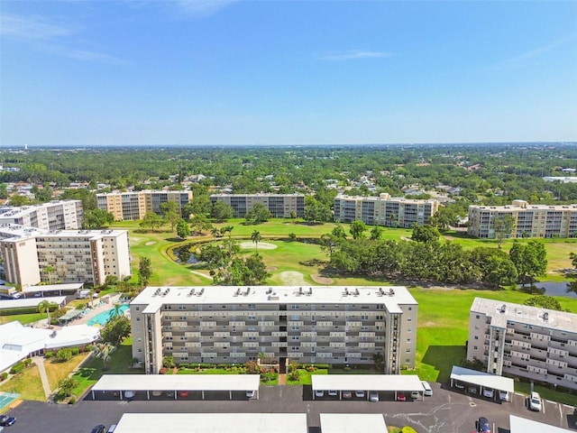 3820 Ironwood Ln Unit 104-I, Bradenton, FL 34209 - bird's eye view of apartment complex / building, a local golf course, and a nearby body of water
