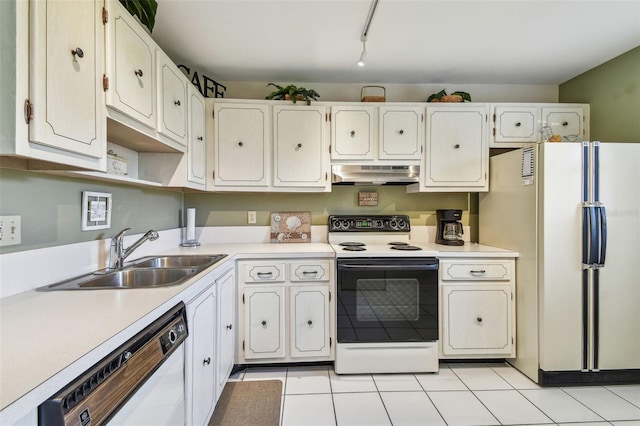 3820 Ironwood Ln Unit 104-I, Bradenton, FL 34209 - kitchen with white appliances, under cabinet range hood, a sink, and light countertops