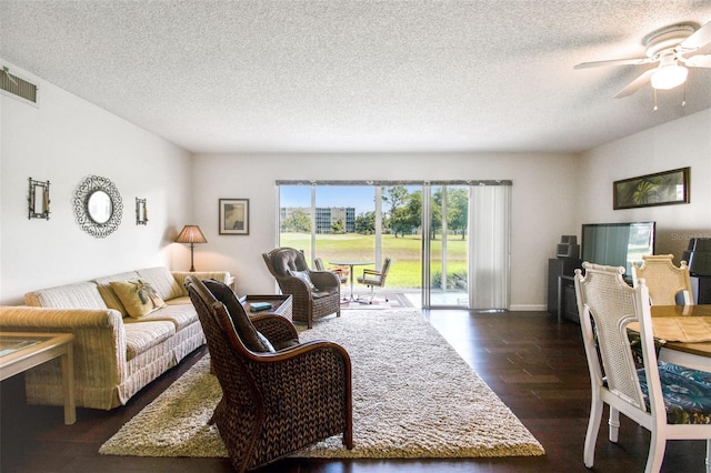 3820 Ironwood Ln Unit 104-I, Bradenton, FL 34209 - living area with a ceiling fan, dark wood-style flooring, and a textured ceiling