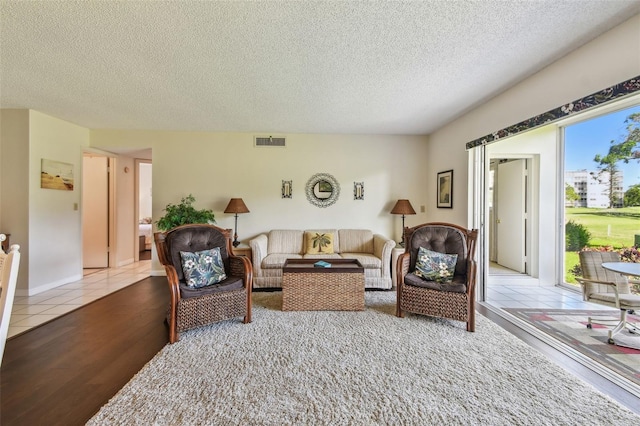 3820 Ironwood Ln Unit 104-I, Bradenton, FL 34209 - living area with a textured ceiling and wood finished floors