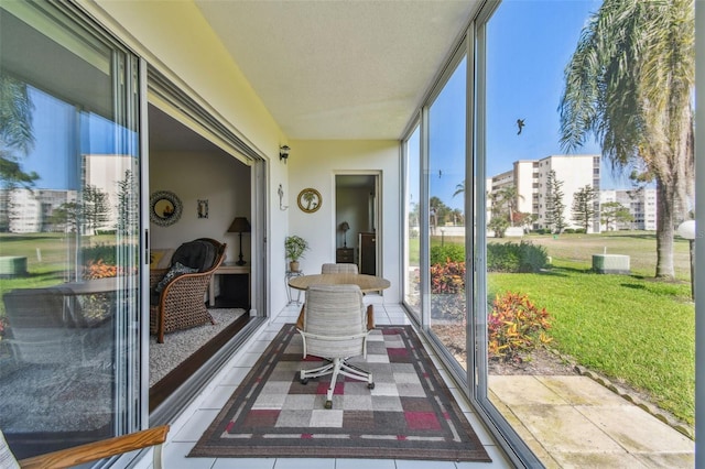 3820 Ironwood Ln Unit 104-I, Bradenton, FL 34209 - sunroom / solarium featuring healthy amount of natural light and a wall of windows