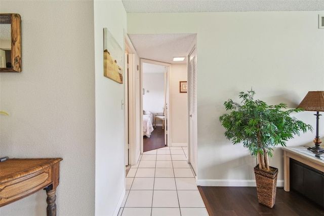 3820 Ironwood Ln Unit 104-I, Bradenton, FL 34209 - hall with baseboards and light tile patterned flooring