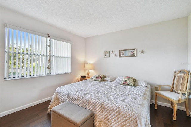 3820 Ironwood Ln Unit 104-I, Bradenton, FL 34209 - bedroom featuring baseboards, wood finished floors, and a textured ceiling