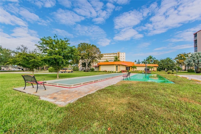 3820 Ironwood Ln Unit 104-I, Bradenton, FL 34209 - surrounding community with a game area and a lawn