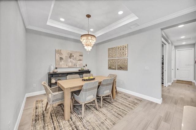 16131 San Donato Pl, Bradenton, FL 34211 - dining room featuring recessed lighting, a chandelier, crown molding, light wood-type flooring, and baseboards