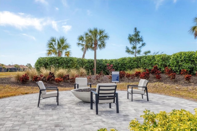 16131 San Donato Pl, Bradenton, FL 34211 - view of patio / terrace with an outdoor fire pit