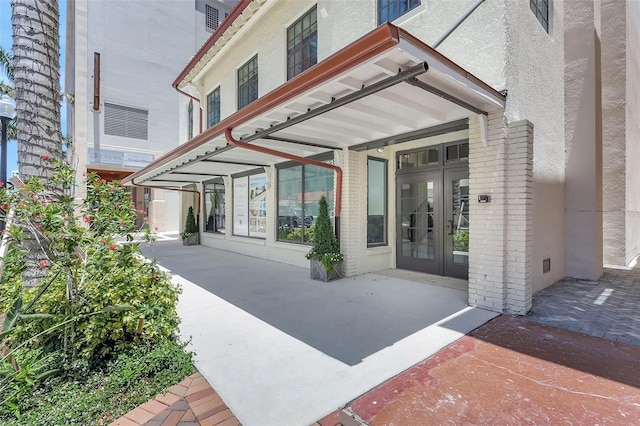 33 S Palm Ave Unit 1101, Sarasota, FL 34236 - doorway to property featuring french doors and brick siding