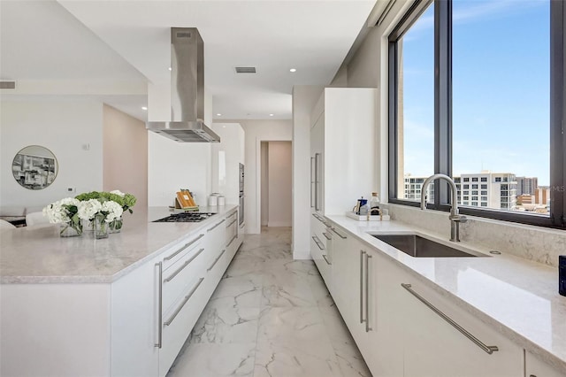 33 S Palm Ave Unit 1101, Sarasota, FL 34236 - kitchen with modern cabinets, island range hood, a sink, light marble finish flooring, and recessed lighting