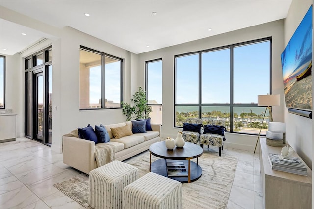 33 S Palm Ave Unit 1101, Sarasota, FL 34236 - living room featuring light marble finish floors, recessed lighting, and a water view