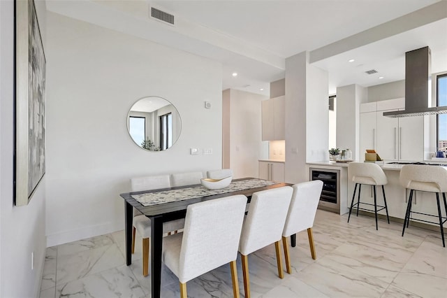 33 S Palm Ave Unit 1101, Sarasota, FL 34236 - dining area with light marble finish flooring, beverage cooler, baseboards, and recessed lighting