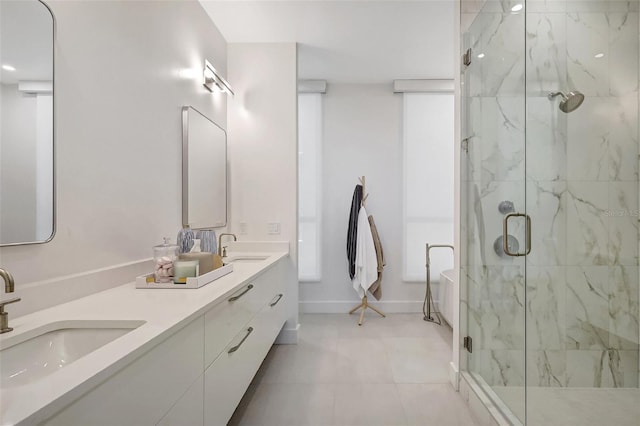 33 S Palm Ave Unit 1101, Sarasota, FL 34236 - bathroom with a marble finish shower, a freestanding bath, double vanity, and baseboards
