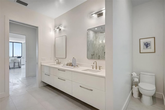 33 S Palm Ave Unit 1101, Sarasota, FL 34236 - full bath featuring a marble finish shower, double vanity, toilet, and baseboards