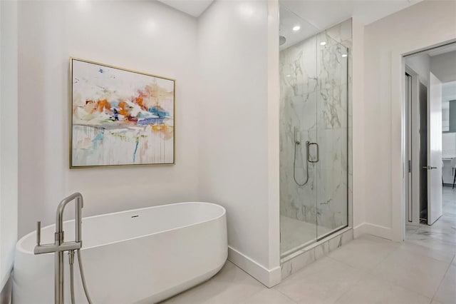33 S Palm Ave Unit 1101, Sarasota, FL 34236 - full bathroom with baseboards, a marble finish shower, a freestanding tub, and recessed lighting