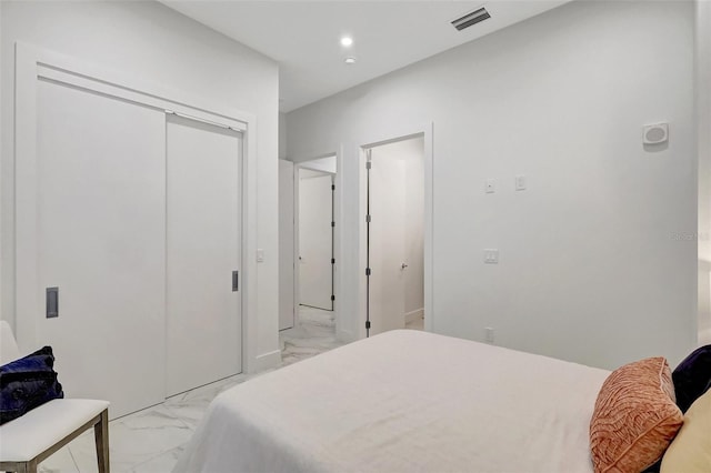 33 S Palm Ave Unit 1101, Sarasota, FL 34236 - bedroom featuring light marble finish floors, a closet, and recessed lighting
