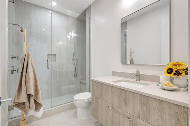 33 S Palm Ave Unit 1101, Sarasota, FL 34236 - bathroom featuring toilet, a shower stall, vanity, and tile patterned flooring