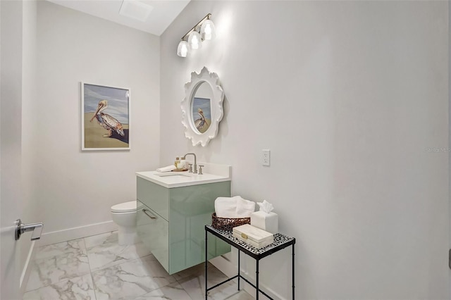33 S Palm Ave Unit 1101, Sarasota, FL 34236 - bathroom with marble look tiles, vanity, toilet, and baseboards