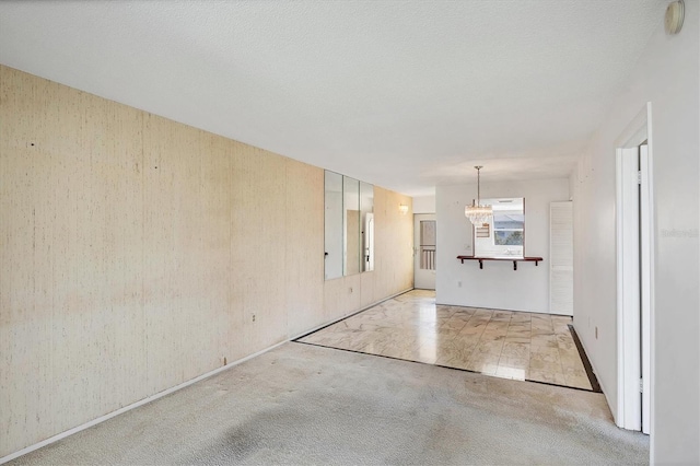9200 Midnight Pass Rd Unit 30, Sarasota, FL 34242 - unfurnished living room with a chandelier and light carpet