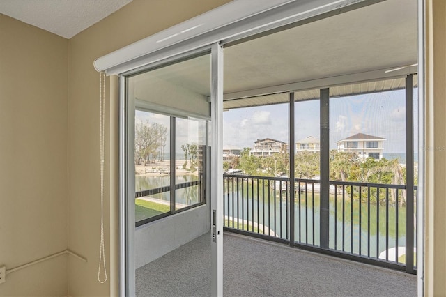 9200 Midnight Pass Rd Unit 30, Sarasota, FL 34242 - unfurnished sunroom with a water view