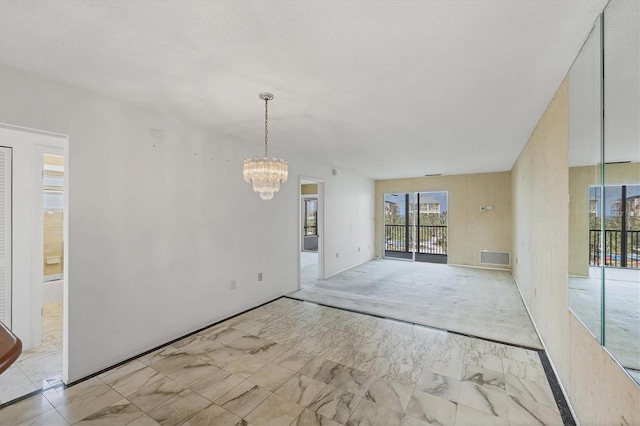 9200 Midnight Pass Rd Unit 30, Sarasota, FL 34242 - spare room featuring a chandelier, marble finish floors, and plenty of natural light