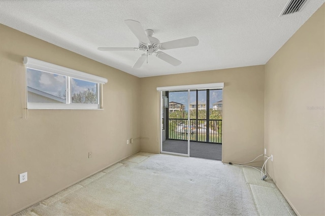 9200 Midnight Pass Rd Unit 30, Sarasota, FL 34242 - carpeted spare room with ceiling fan and a textured ceiling