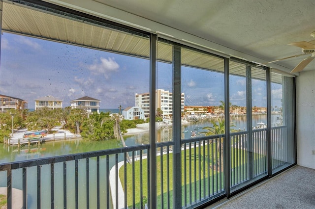 9200 Midnight Pass Rd Unit 30, Sarasota, FL 34242 - unfurnished sunroom with a water view