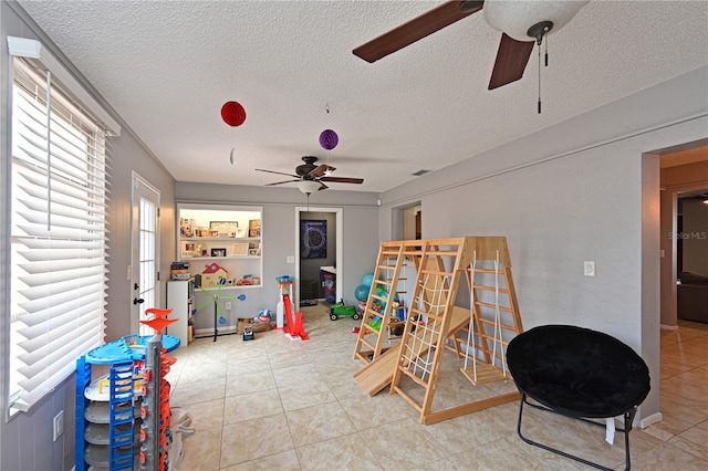 3417 49th St W, Bradenton, FL 34209 - rec room with a ceiling fan, a textured ceiling, and tile patterned flooring