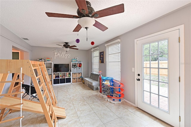 3417 49th St W, Bradenton, FL 34209 - bedroom featuring access to outside, a textured ceiling, light tile patterned floors, and a ceiling fan