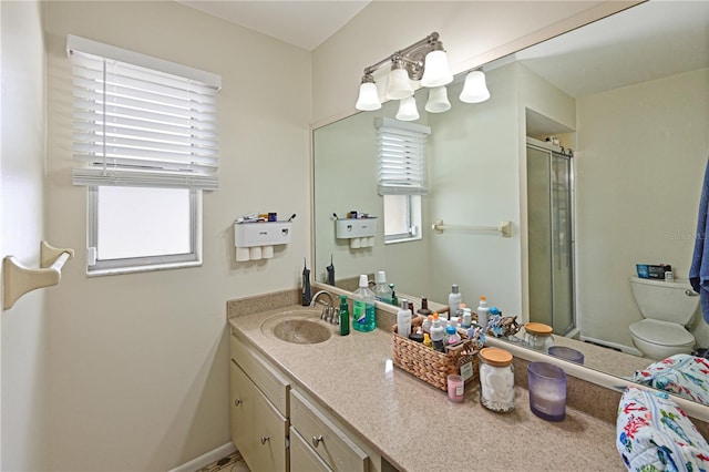 3417 49th St W, Bradenton, FL 34209 - full bath with a stall shower, vanity, plenty of natural light, and toilet
