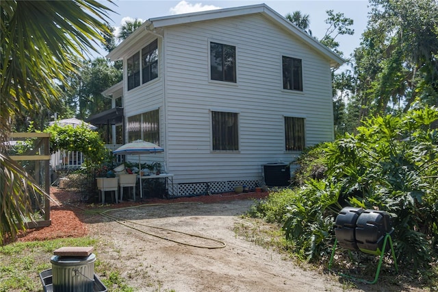7251 Fish Farm Rd, Palmetto, FL 34221 - rear view of property with central AC