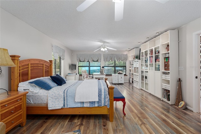 7251 Fish Farm Rd, Palmetto, FL 34221 - bedroom with wood finished floors and a textured ceiling