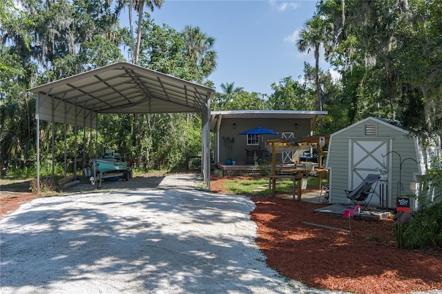 7251 Fish Farm Rd, Palmetto, FL 34221 - view of vehicle parking with a storage shed, a detached carport, and driveway