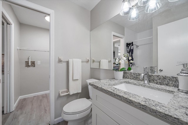 400 E Baffin Dr, Venice, FL 34293 - bathroom with vanity, wood finished floors, and a chandelier