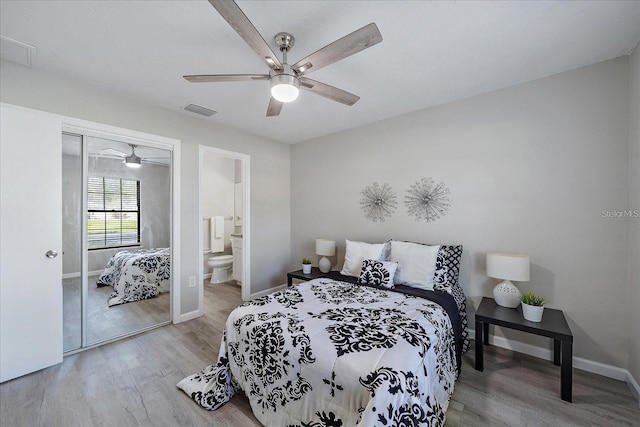 400 E Baffin Dr, Venice, FL 34293 - bedroom featuring wood finished floors, a closet, ceiling fan, and ensuite bathroom