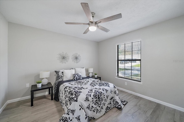 400 E Baffin Dr, Venice, FL 34293 - bedroom with wood finished floors and a ceiling fan