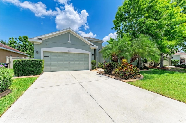 11254 82nd St E, Parrish, FL 34219 - single story home featuring concrete driveway, a front yard, a garage, and stucco siding