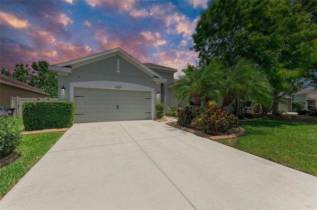 11254 82nd St E, Parrish, FL 34219 - ranch-style house with concrete driveway, stucco siding, a garage, and a front yard