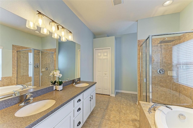 11254 82nd St E, Parrish, FL 34219 - bathroom with double vanity, a bath, a stall shower, and tile patterned flooring