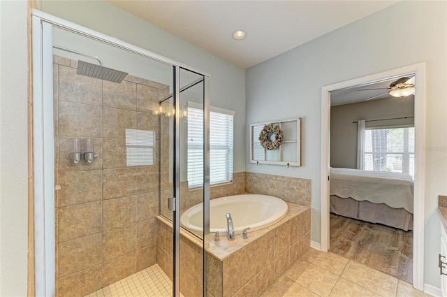 11254 82nd St E, Parrish, FL 34219 - bathroom featuring ensuite bath, a garden tub, a stall shower, tile patterned flooring, and ceiling fan