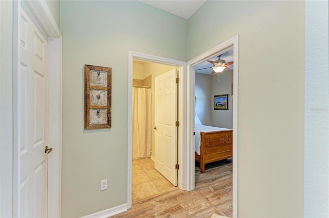 11254 82nd St E, Parrish, FL 34219 - hallway featuring light wood finished floors
