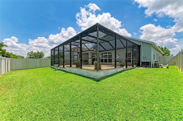 11254 82nd St E, Parrish, FL 34219 - rear view of property with a patio, glass enclosure, and central AC