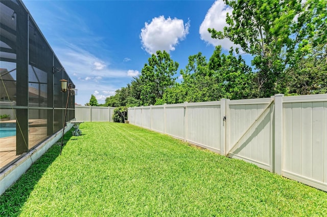 11254 82nd St E, Parrish, FL 34219 - view of yard with a lanai, an outdoor pool, and a gate