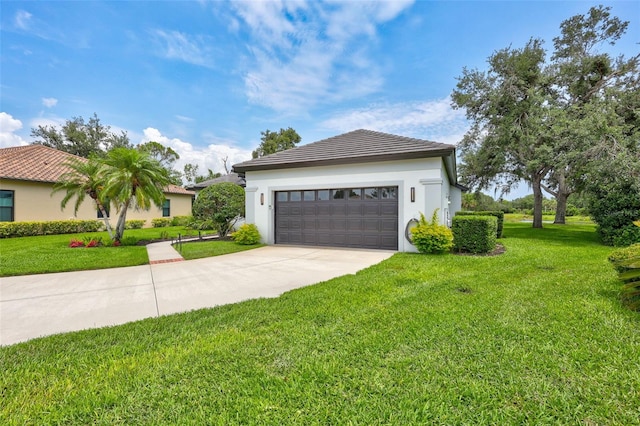 5285 Far Oak Cir, Sarasota, FL 34238 - view of front of house with concrete driveway, a front lawn, a garage, and stucco siding