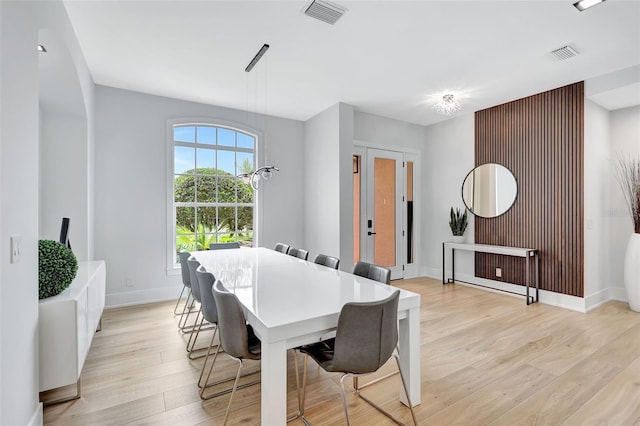 5285 Far Oak Cir, Sarasota, FL 34238 - dining room with light wood-style floors and baseboards