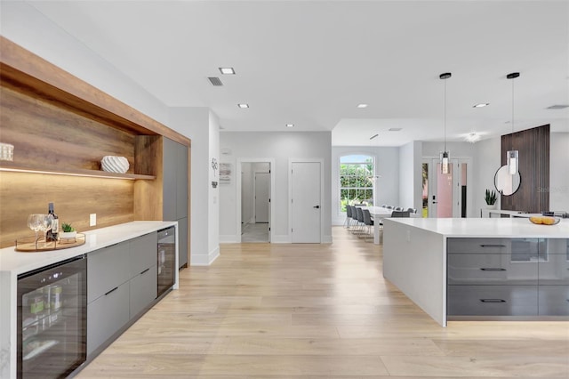 5285 Far Oak Cir, Sarasota, FL 34238 - kitchen featuring gray cabinetry, beverage cooler, modern cabinets, and recessed lighting